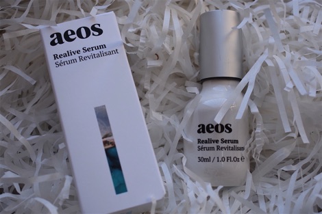 aeos serum in a white bottle and white box